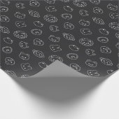 Schattige wit dierenhoofd doedels op zwart cadeaupapier (Hoek)