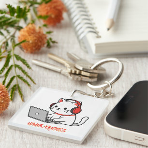 Schattige witte kat met rode koptelefoon laptop sleutelhanger
