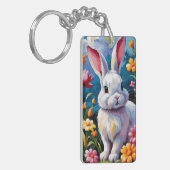 Schattige witte konijn omringd door levendige bloe sleutelhanger (Voorkant Links)