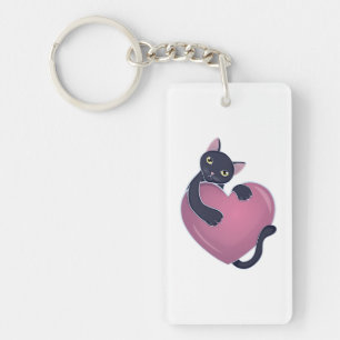 Schattige Zwarte Kat die zich vastklampt aan Groot Sleutelhanger