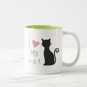 schattige zwarte kat met heerlijk roze hart tweekleurige koffiemok