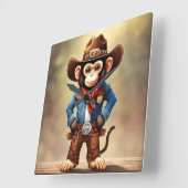 Schattigee aap in een cowboykostuum vierkante klok (Hoek)