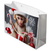 Schattigee aap met een kerstmuts groot cadeauzakje (Achterkant Gekanteld)
