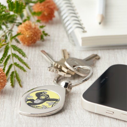 Schattigee chimpansee op de tak begroet sleutelhanger (Zijkant)