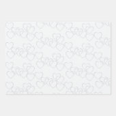 Schattigee gouden en zilveren hart charmes op wit inpakpapier vel (Voorkant 2)