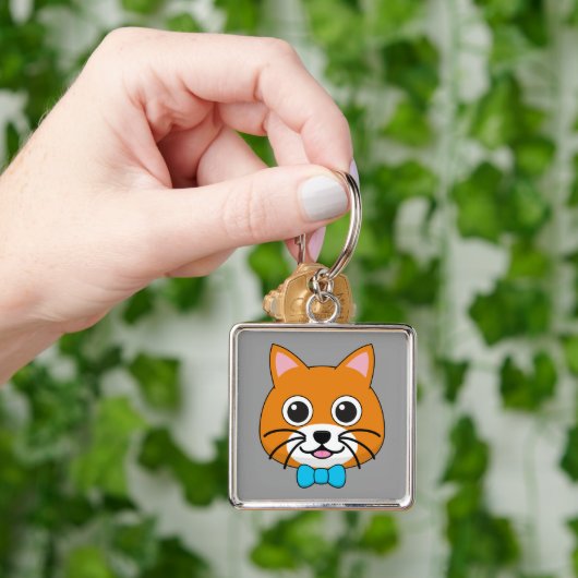 Schattigee Happy Ginger Cat met Papillon Sleutelhanger (Hand)