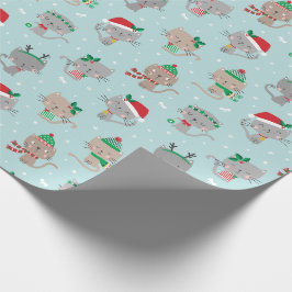 Schattigee kerstkatten op lichtblauw cadeaupapier