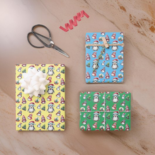 Schattigee kerstpinguïns op geel groen en blauw inpakpapier vel
