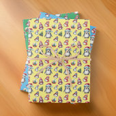 Schattigee kerstpinguïns op geel groen en blauw inpakpapier vel