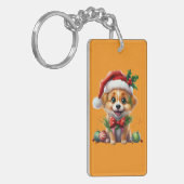 Schattigee kerstpuppy met kerstmuts en strik sleutelhanger (Voorkant Links)