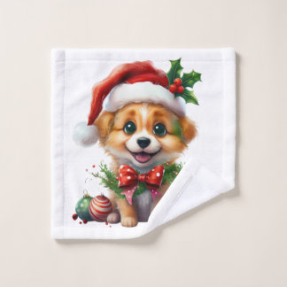 Schattigee kerstpuppy met kerstmuts en strik washandje