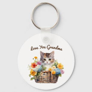Schattigee kitten in mandje met bloemen sleutelhanger