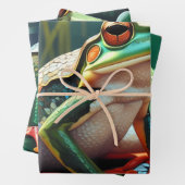 Schattigee kleine kikkertjes zitten op een vijver inpakpapier vel (In situ)