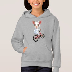Schattigee kleine witte geit op een fiets