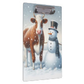 Schattigee koe en sneeuwman in het winterveld klembord (Rechts)