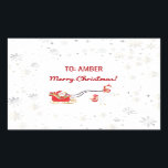 Schattigee Moderne Eenhoorn Santa Gepersonaliseerd Rechthoekige Sticker<br><div class="desc">Schattigee, meisjesachtige maar ook elegante kerstcadeau sticker voor kinderen met een afbeelding van een magisch, glam eenhoornpaard met een rode en gouden manen en staart trekken Santa's slee (vol met geschenken), de begroeting "Vrolijk kerstfeest!" in cursief script / kalligrafie, en een aangepaste naam. Het ontwerp bevat zilveren en gebroken witte...</div>