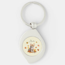 Schattigee Oranje Tabby Kitten in herfstbladeren