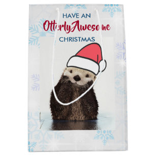 Schattigee otter met een kerstmuts medium cadeauzakje