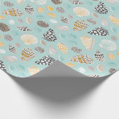 Schattigee pattereerde schelpen op munt cadeaupapier (Hoek)