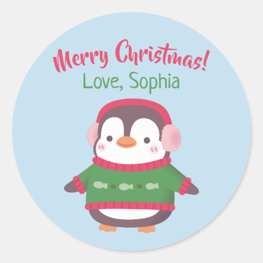 Schattigee pinguïn met oorkappen en kersttrui ronde sticker (Voorkant)