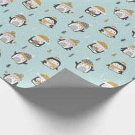 Schattigee pinguïns met kleine boompjes op lichtbl cadeaupapier