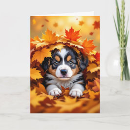 Schattigee puppy hond in herfstbladeren kaart