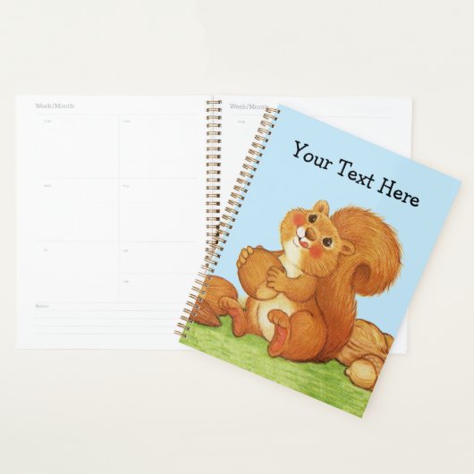 Schattigee rode eekhoorn met eikel in grasblauwe l planner (Display)