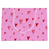 Schattigee rode hartjes op roze achtergrond groot cadeauzakje (Voorkant)