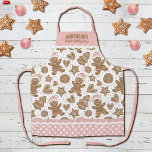 Schattigee Roze Kerstkoekjes Bakken Crew Schort<br><div class="desc">Een schattig vakantie peperkoek koekjespatroon siert dit kerstkoekje bakken crew schort. Personaliseer het met jouw naam. Leuk voor het bakken van kerst! De rand van schort heeft een roze en witte stip met een rif. Een leuk cadeau voor kerst. Ontworpen voor u door Blackberry Boulevard.</div>