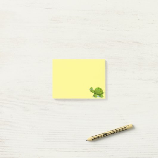 Schattigee schildpad op geel post-it® notes (Op bureau)