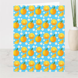 Schattigee sinaasappels en witte bloemen kaart