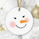 Schattigee Sneeuwman Gezicht Vakantie Ornament<br><div class="desc">Je vrienden en familie zullen glimlachen dit winterseizoen met dit schattige en meisjesachtige sneeuwpop kerst ornament. Design beschikt over een vrolijke sneeuwdame met warme rooskleurige wangen, wimpers, een wortelneus en een glimlach gemaakt van steenkool. Sneeuwwitje, zwart, roze en oranje designkleuren. Tweezijdig ornament kan worden gepersonaliseerd met een naam of andere...</div>