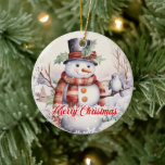 Schattigee sneeuwman met vogeltje in de sneeuw keramisch ornament<br><div class="desc">'Dit is het seizoen,  schattige klassieke sneeuwpop met een vogeltje in sneeuw en rood feestelijk glinsterend script "Vrolijk kerstfeest" - perfect kerstboom keramisch ornament. Violet Prints</div>