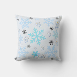 Schattigee sneeuwpoppen en sneeuwvlokken in lichtb kussen