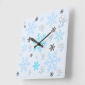 Schattigee sneeuwpoppen en sneeuwvlokken in lichtb vierkante klok (Hoek)