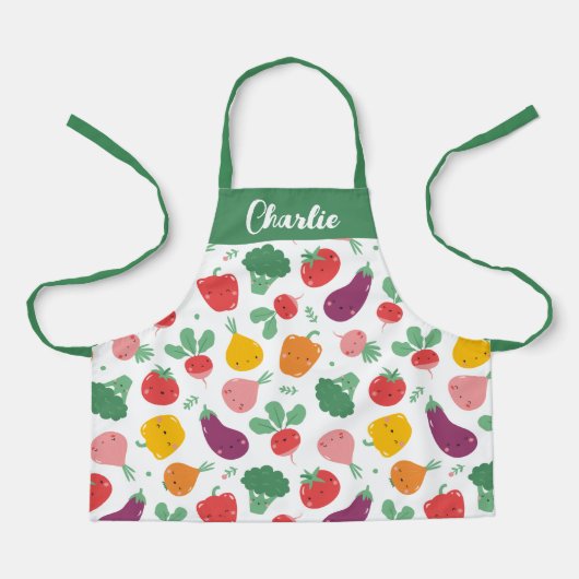 Schattigee vrolijke kleurrijke groenten op witte a schort (Voorkant)