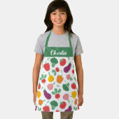Schattigee vrolijke kleurrijke groenten op witte a schort (Insitu)