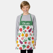 Schattigee vrolijke kleurrijke groenten op witte a schort (Gedragen)