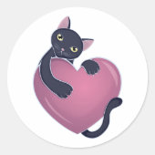 Schattigee zwarte kat die zich vasthoudt aan het g ronde sticker (Voorkant)