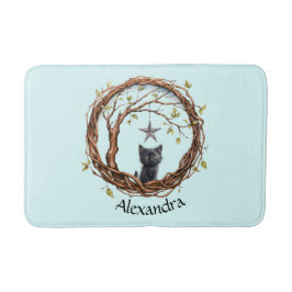 Schattigee zwarte kitten die naar een ster kijkt badmat