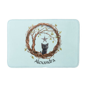 Schattigee zwarte kitten die naar een ster kijkt badmat