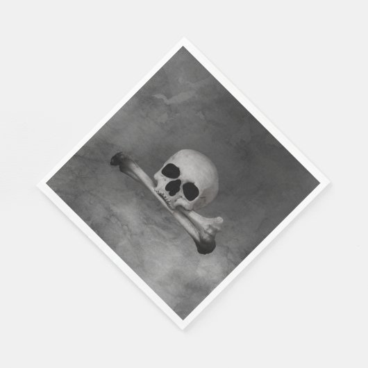 schedel en kruisbeenderen op grijze textuur servet (Hoek)