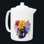 SCHEDELBLAADJES THEEPOT<br><div class="desc">Skull Petals is een opvallende fusie van levendige rebellie en delicate gratie. Dit originele kunstwerk is voorzien van een hoogglans metalen schedel bekroond met bloemetjes - gedurfde lelies, weelderige pioenen en zachte bloemen brengen contrast en schoonheid aan het edgy ontwerp. Ideaal voor liefhebbers van alternatieve mode, donkere romance en een...</div>
