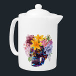 SCHEDELBLAADJES THEEPOT<br><div class="desc">Skull Petals is een opvallende fusie van levendige rebellie en delicate gratie. Dit originele kunstwerk is voorzien van een hoogglans metalen schedel bekroond met bloemetjes - gedurfde lelies, weelderige pioenen en zachte bloemen brengen contrast en schoonheid aan het edgy ontwerp. Ideaal voor liefhebbers van alternatieve mode, donkere romance en een...</div>