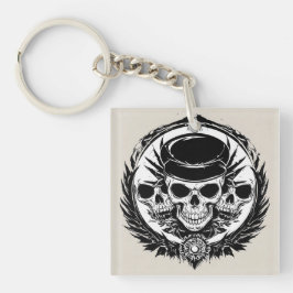 Schedelontwerp met vleugels en symbolen sleutelhanger