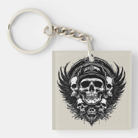 Schedelontwerp met vleugels en symbolen sleutelhanger (voorkant)