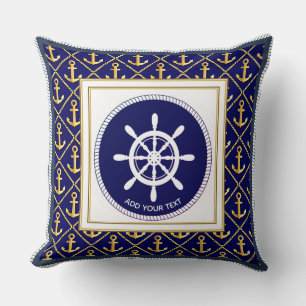 Scheepsanker en stuurwiel in marineblauw kussen