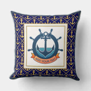 Scheepsanker en stuurwiel in marineblauw kussen