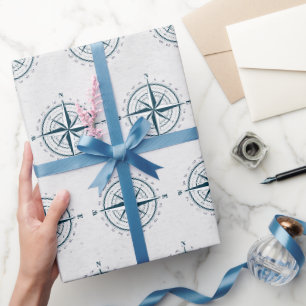 Scheepskompas op gestructureerde grijze achtergron cadeaupapier