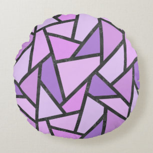 Scheluwen van lila gekleurd glas rond kussen